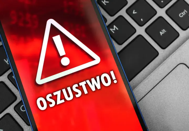 Ostrzeżenie na ekranie telefonu: "OSZUSTWO!". Uważaj na oszustwa na OLX, gdy widzisz takie komunikaty.